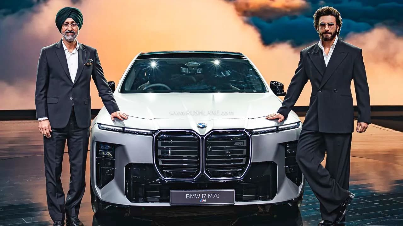 BMW i7 M70 electric sedan showcased at an event.