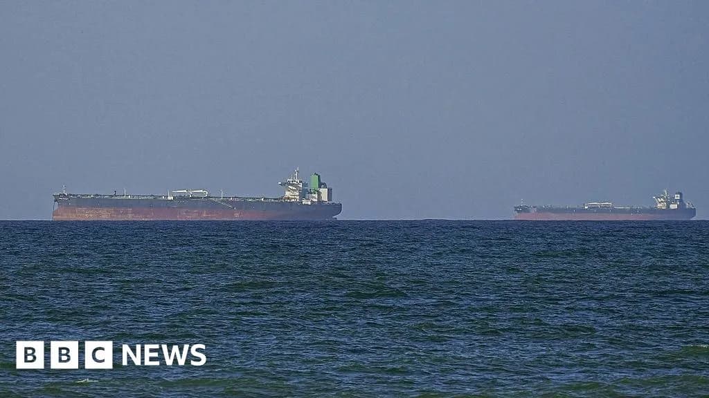 Two oil tankers in the ocean.